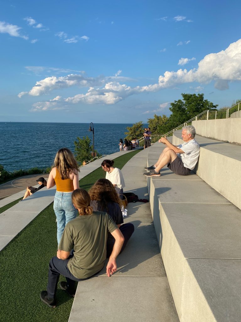 People relaxing at the Solstice Steps overlooking Lake Erie at Lakewood Park